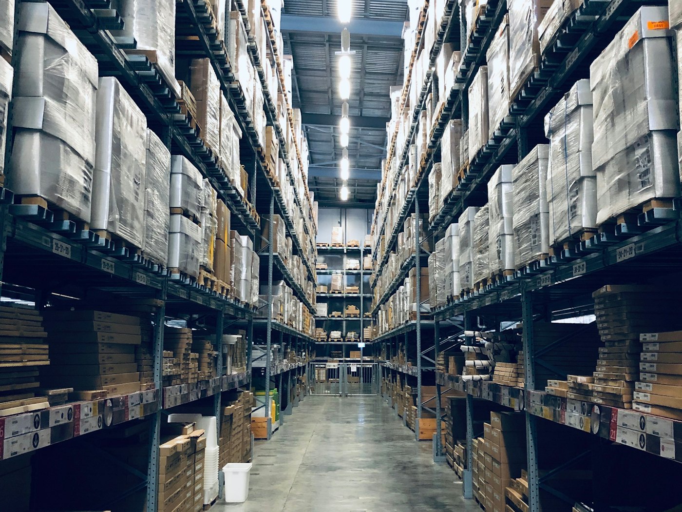 Tall warehouse racking stacked with boxed inventory